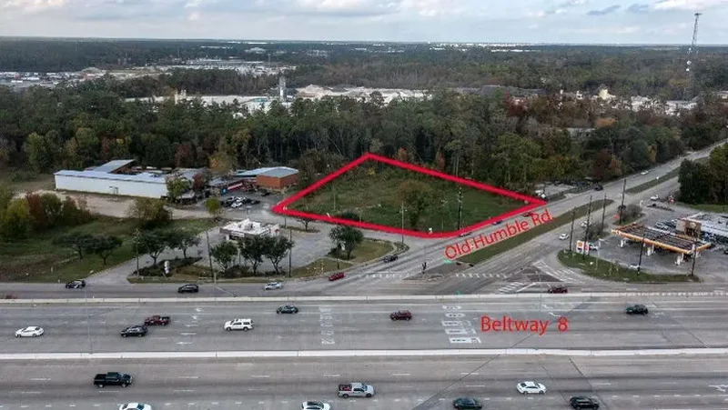 Aerial view of a 1.43 acre commercial land parcel outlined near Beltway 8, Humble, Texas