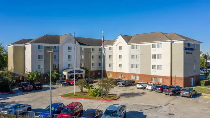 Exterior of a four story extended stay hotel with parking, Houston, Texas